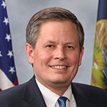 Steve Daines, Attribution: By U.S. Senate Photographic Studio - [1], Public Domain, https://commons.wikimedia.org/w/index.php?curid=78476532