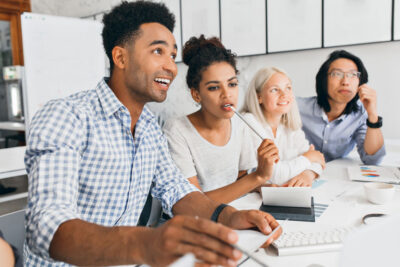 Group of people at a table looking at something