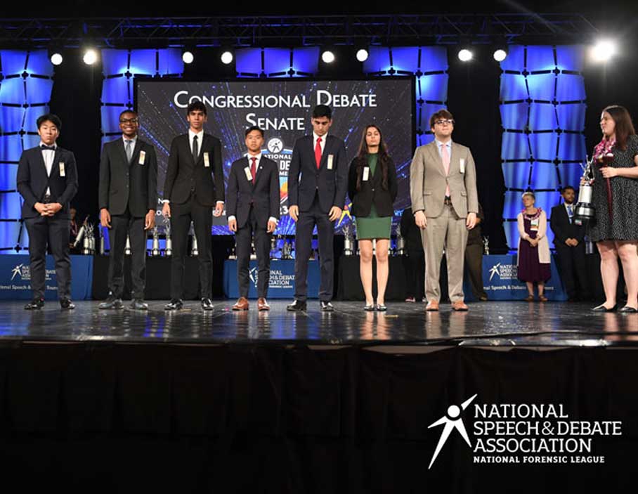 Group of students standing on stage at the National Tournament.