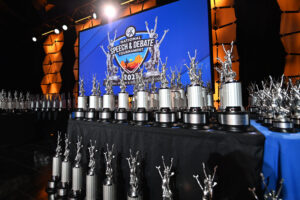 Tournament Resources Group of trophies on a large tournament stage